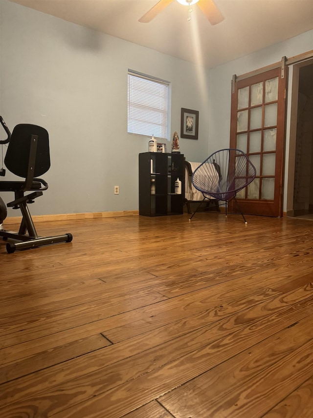 interior space featuring ceiling fan and hardwood / wood-style floors