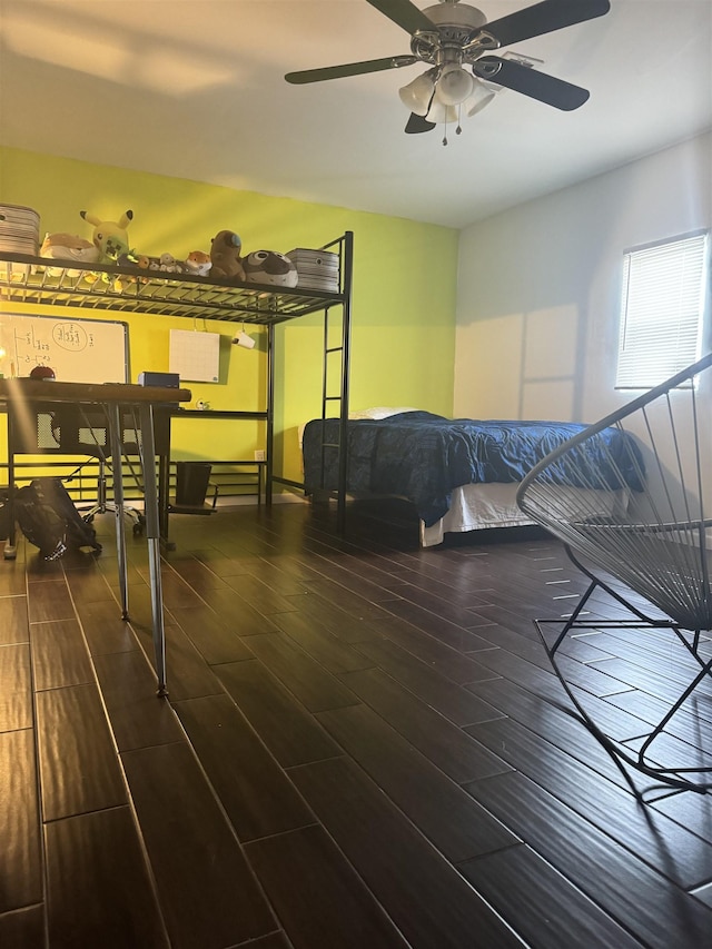 bedroom featuring ceiling fan and dark wood-type flooring