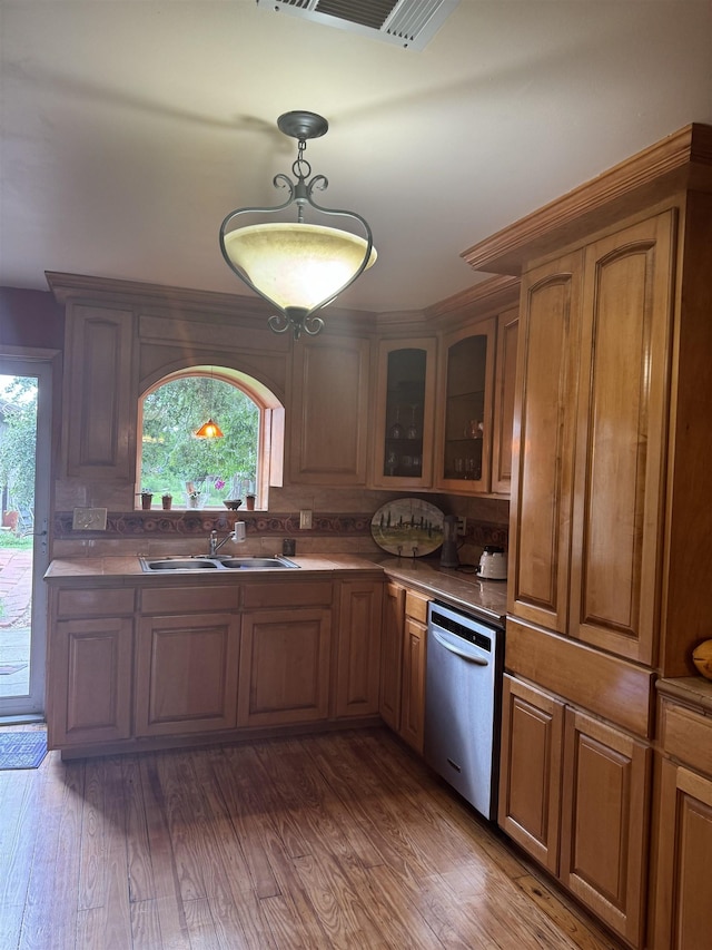 kitchen featuring dishwasher, dark hardwood / wood-style floors, plenty of natural light, and sink