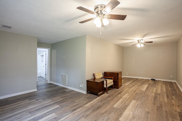 411 3rd St, Nederland, TX 77627 - unfurnished room with a ceiling fan, wood finished floors, and baseboards
