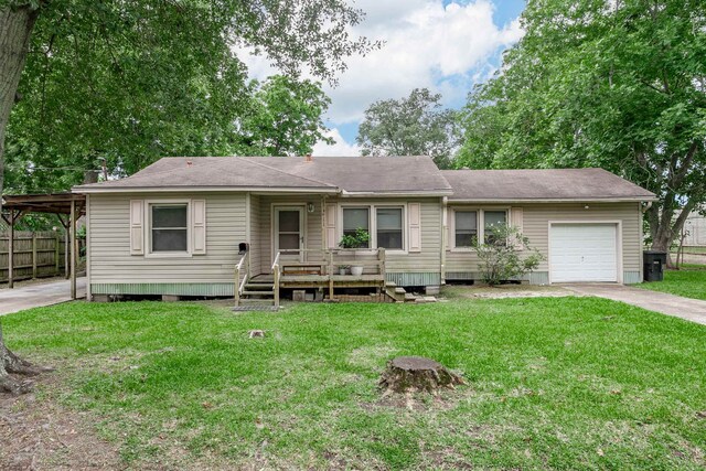 411 3rd St, Nederland, TX 77627 - view of front of property featuring a garage and driveway