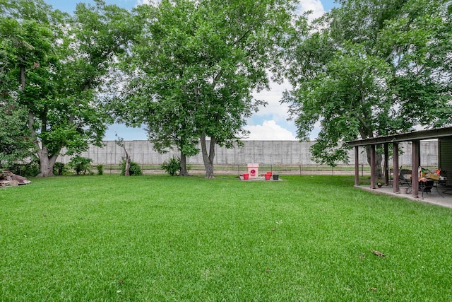 411 3rd St, Nederland, TX 77627 - view of yard featuring a patio area