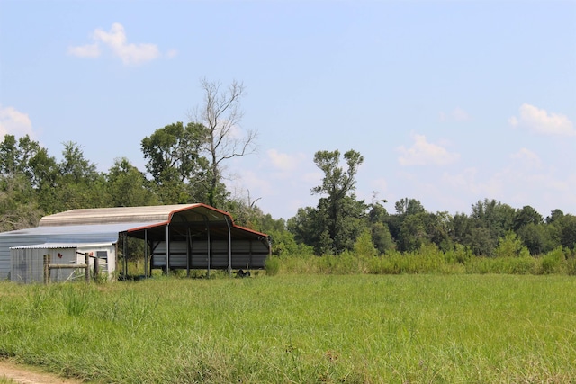 exterior space featuring an outbuilding and a detached carport