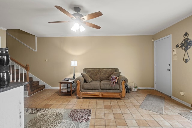 sitting room featuring a ceiling fan, stairs, ornamental molding, and light tile patterned flooring