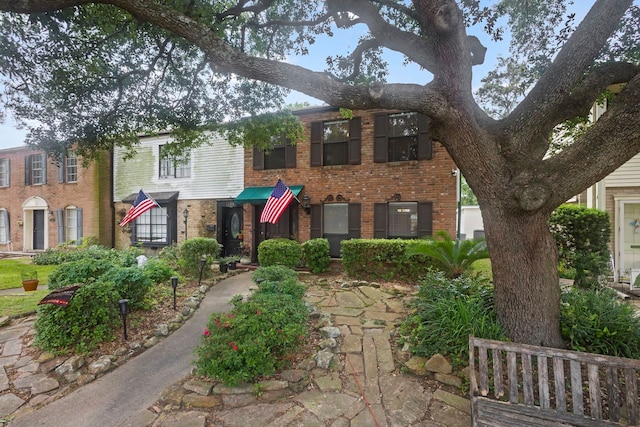view of front of house featuring brick siding