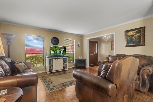 living area featuring baseboards, ornamental molding, and an inviting chandelier