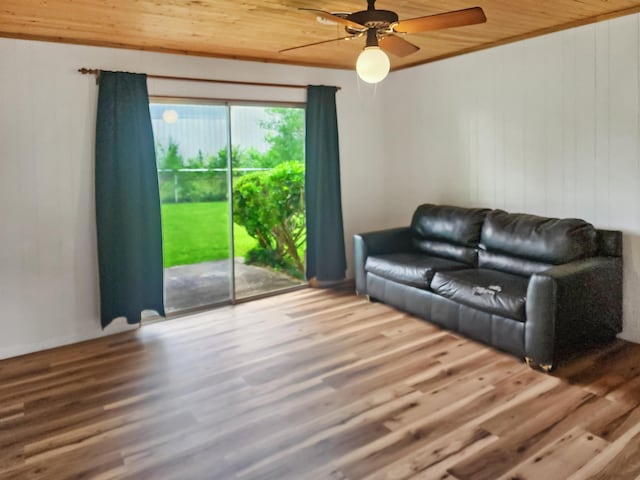4296 W US Highway 190, Jasper, TX 75951 - living area with wooden ceiling, a ceiling fan, wood finished floors, and wooden walls
