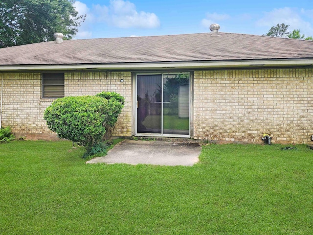 4296 W US Highway 190, Jasper, TX 75951 - rear view of house with brick siding, roof with shingles, and a yard
