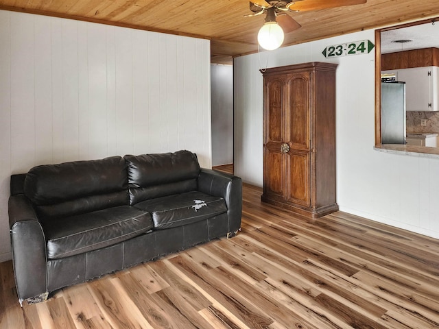 4296 W US Highway 190, Jasper, TX 75951 - living room with ceiling fan, light wood-type flooring, wood ceiling, and wood walls