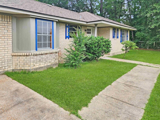 4296 W US Highway 190, Jasper, TX 75951 - single story home with brick siding, a front lawn, and a shingled roof