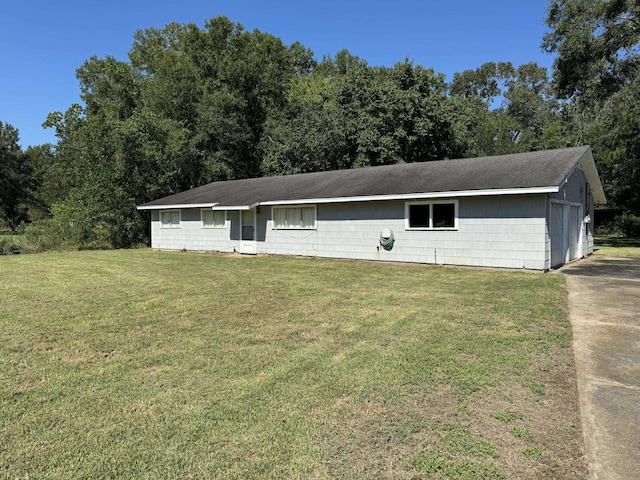 ranch-style house with a front lawn