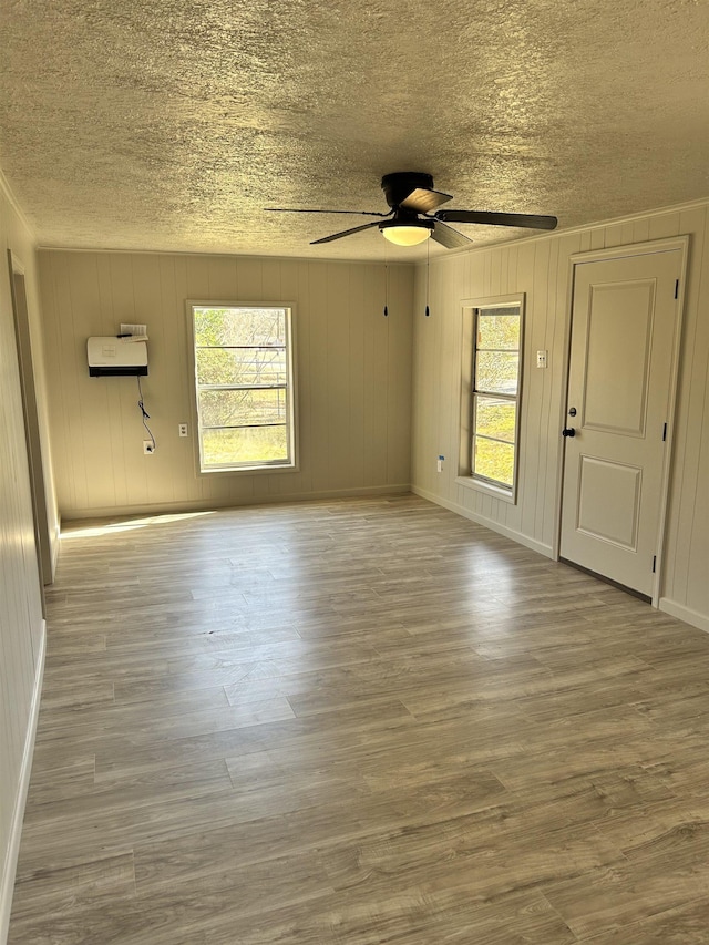 unfurnished room with light hardwood / wood-style flooring and ceiling fan