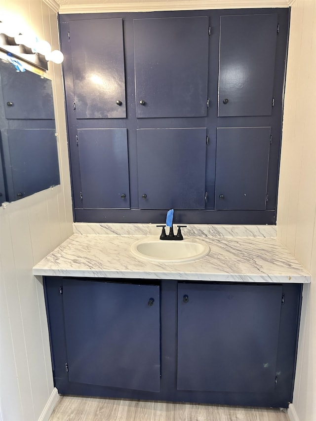 bathroom with vanity and hardwood / wood-style floors