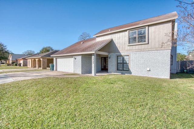 view of front of property with a front lawn and a garage