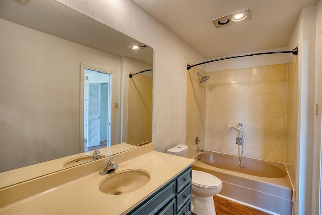 full bathroom with shower / bath combination, toilet, vanity, and hardwood / wood-style floors