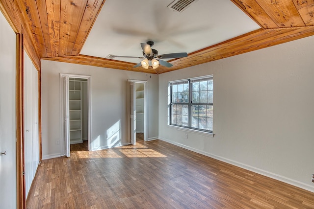 unfurnished bedroom featuring ceiling fan, vaulted ceiling, wood ceiling, and hardwood / wood-style flooring