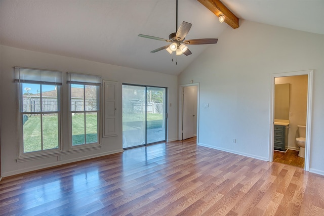 interior space featuring ceiling fan, light hardwood / wood-style flooring, beam ceiling, and high vaulted ceiling