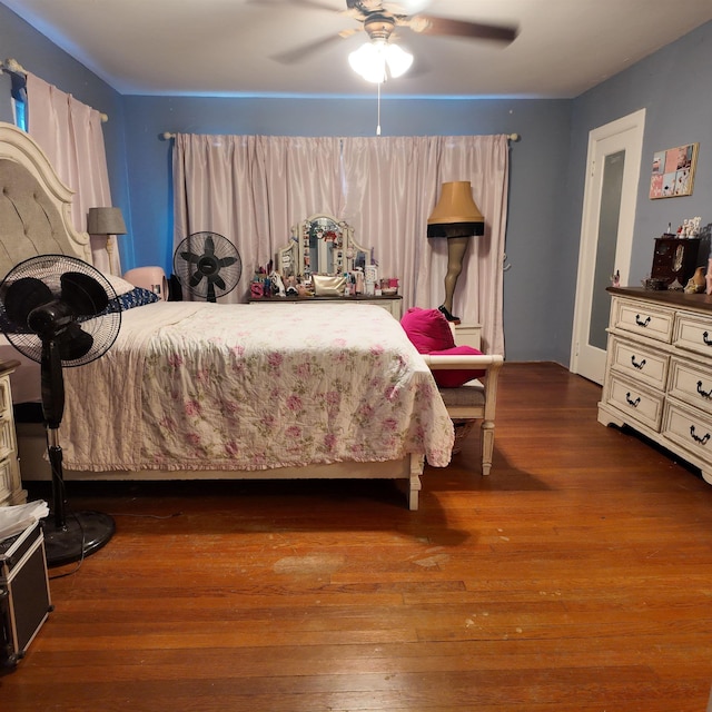 bedroom featuring dark hardwood / wood-style floors and ceiling fan