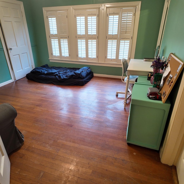 office space with wood-type flooring