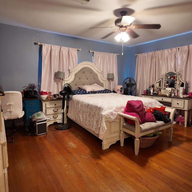 bedroom featuring hardwood / wood-style floors and ceiling fan