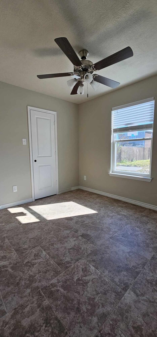 empty room with ceiling fan