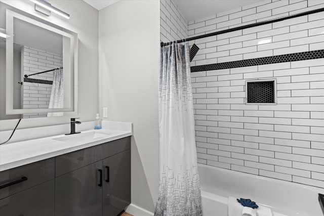 13370 Capital Dr, Bevil Oaks, TX 77713 - bathroom featuring shower / bath combo, vanity, and baseboards