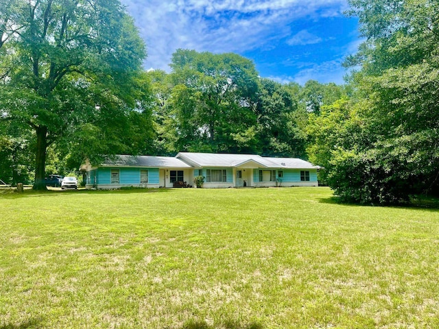 ranch-style home with a front lawn