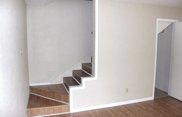 8642 Glen Meadow Ln, Beaumont, TX 77706 - staircase featuring baseboards and wood finished floors