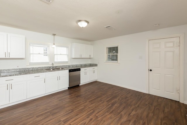 kitchen featuring stainless steel dishwasher, a sink, dark wood-type flooring, light stone countertops, and white cabinetry