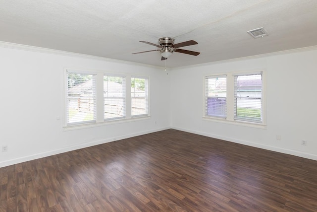 unfurnished room featuring ornamental molding, ceiling fan, dark wood-style flooring, and baseboards