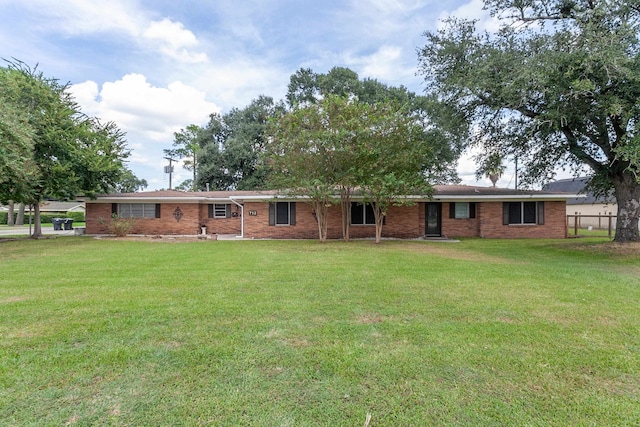 back of property with a lawn