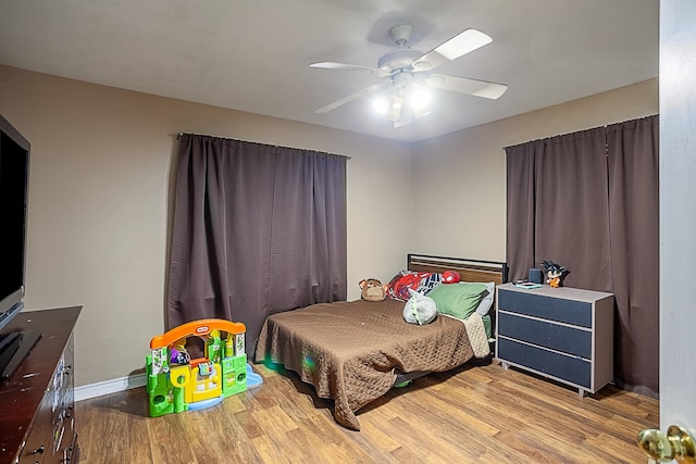 bedroom featuring ceiling fan and light wood-type flooring