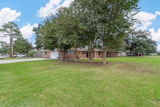 view of front facade with a front yard and a garage