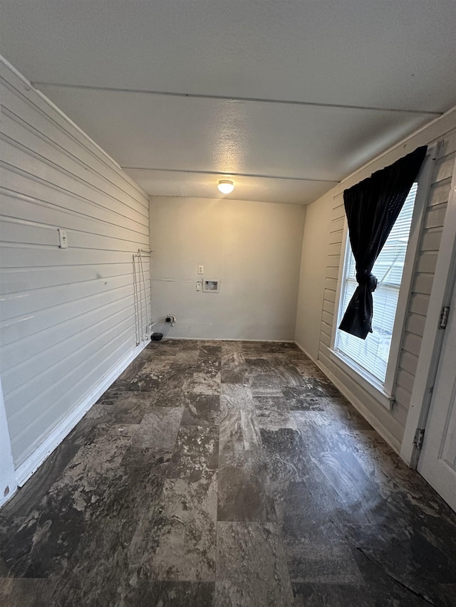 laundry room featuring wooden walls