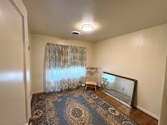 207 Elm St, Silsbee, TX 77656 - living area featuring wood finished floors and baseboards