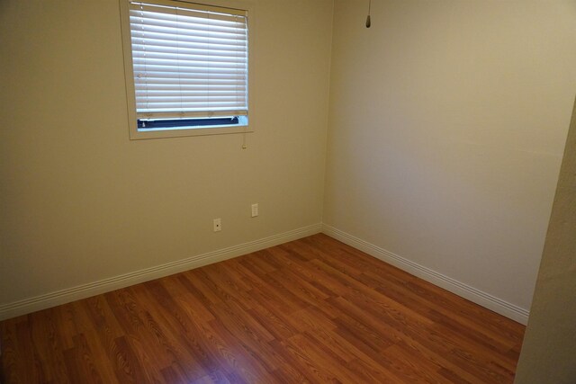 bedroom with hardwood / wood-style floors