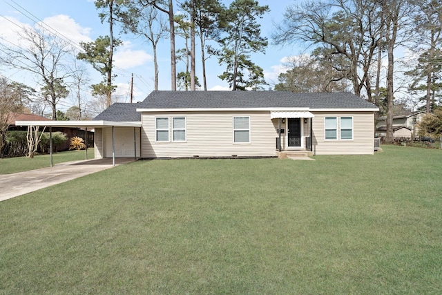 ranch-style house with concrete driveway, a shingled roof, a front yard, and an attached carport