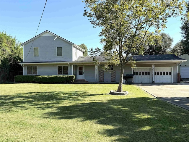 view of front of house featuring a garage and a front yard