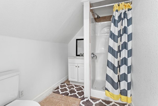 5320 Manion Way, Lumberton, TX 77657 - bathroom featuring a shower with curtain, lofted ceiling, tile patterned flooring, and vanity