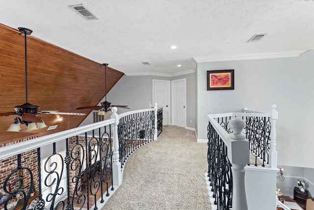 5320 Manion Way, Lumberton, TX 77657 - hallway with an upstairs landing, carpet, a textured ceiling, crown molding, and recessed lighting