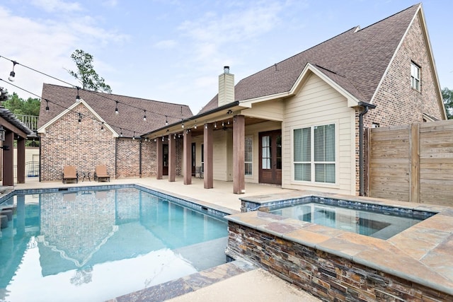 5320 Manion Way, Lumberton, TX 77657 - view of swimming pool with an in-ground hot tub and a patio