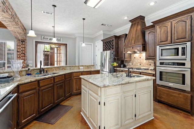 5320 Manion Way, Lumberton, TX 77657 - kitchen featuring appliances with stainless steel finishes, custom range hood, concrete floors, decorative backsplash, and a center island with sink