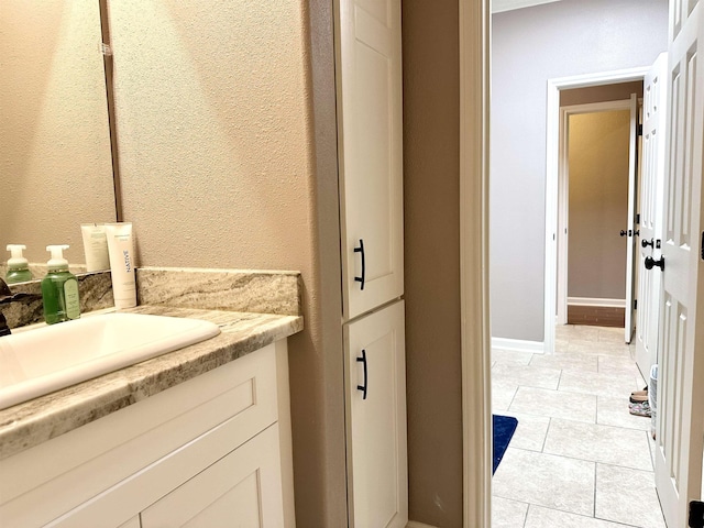 bathroom featuring tile patterned floors and vanity