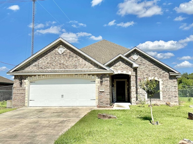 view of front of house with a front lawn and a garage