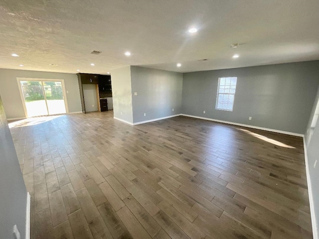 unfurnished room with dark hardwood / wood-style floors