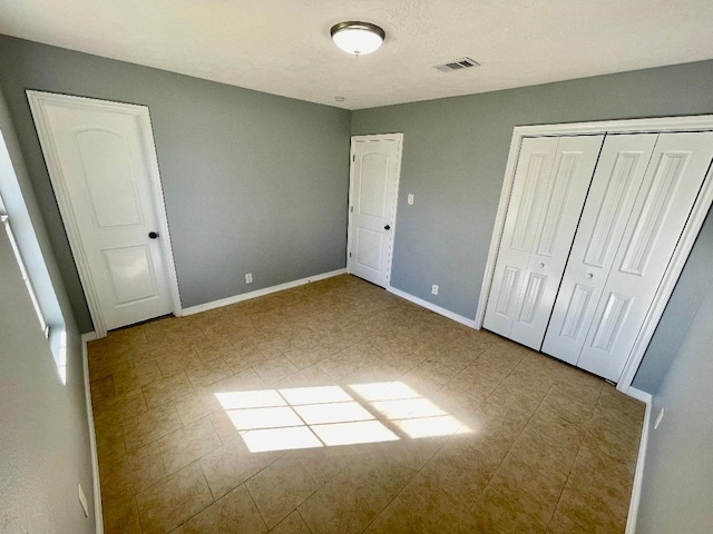 unfurnished bedroom with a closet