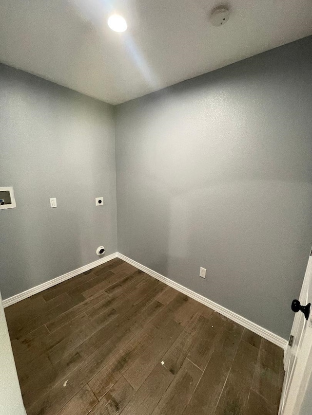 washroom featuring hookup for an electric dryer, dark hardwood / wood-style floors, and washer hookup