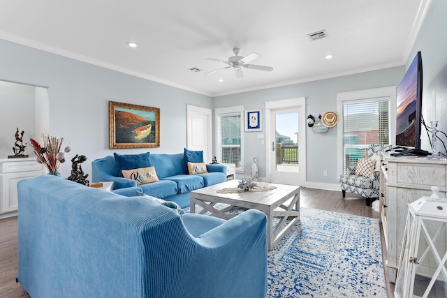 living room with ceiling fan, hardwood / wood-style floors, and ornamental molding