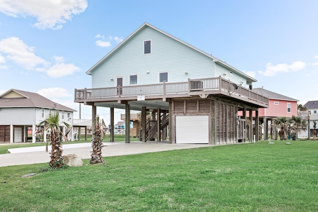 back of house with a garage, a carport, and a lawn