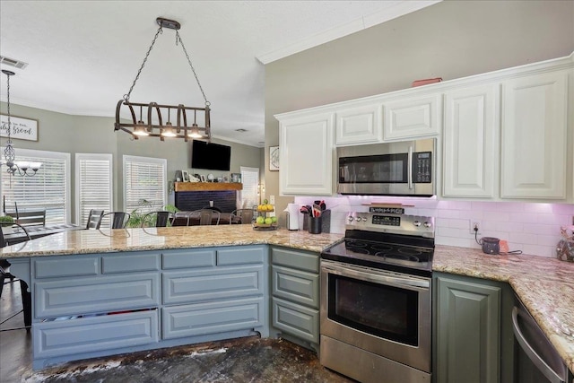 265 Callie Ln, Orange, TX 77632 - kitchen featuring stainless steel appliances, ornamental molding, a peninsula, white cabinets, and a chandelier